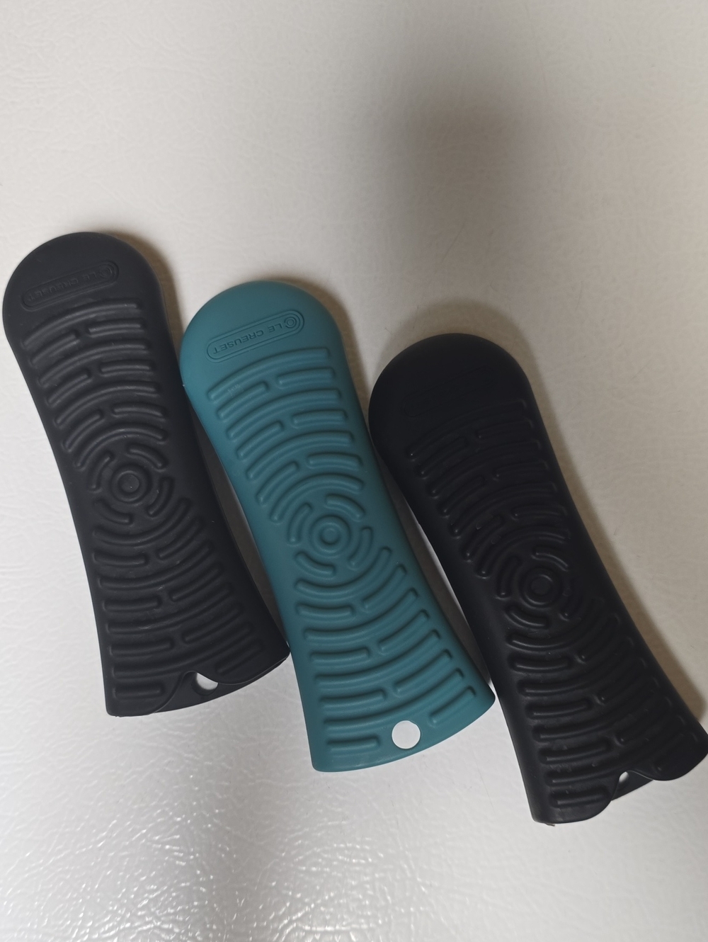 Le Creuset Silicone Handle Covers in Teal and Black